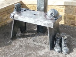 A sculpture of a cracket - used by Miners down the pit, the wooden stools  also made their way into houses 